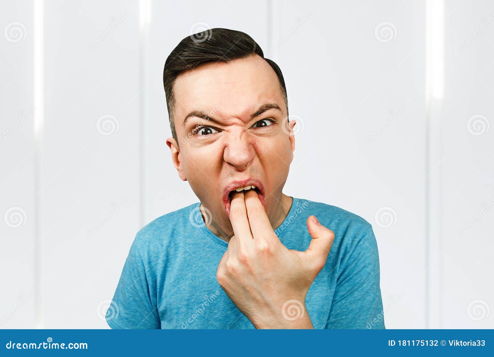 young man inserts two fingers in the mouth to induce vomiting