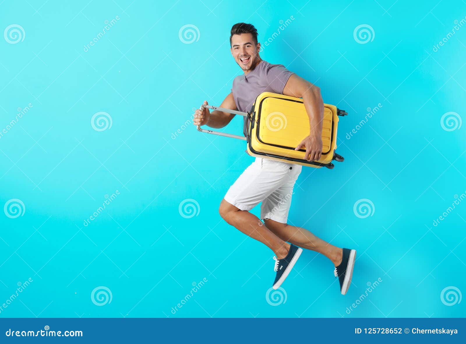 Young Man Jumping with Suitcase Stock Photo Image of adult, destination 125728652