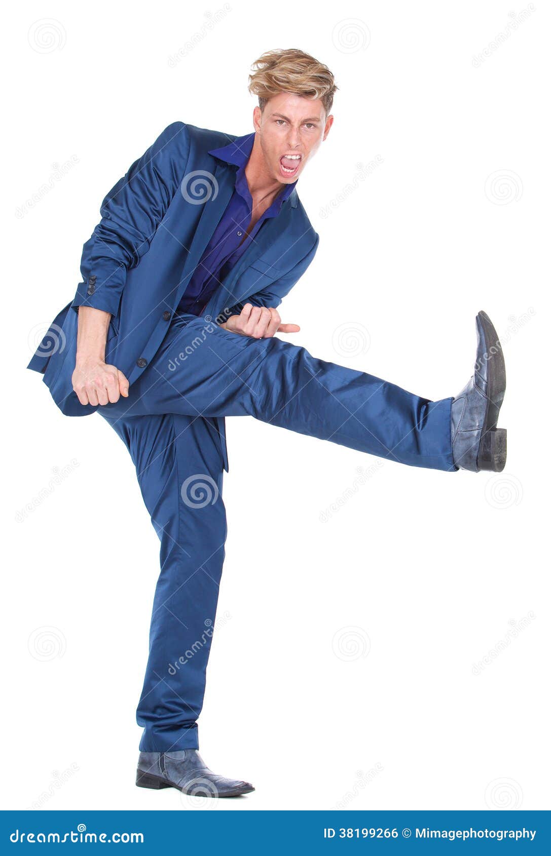 Young man kicking leg up stock photo. Image of modern 38199266