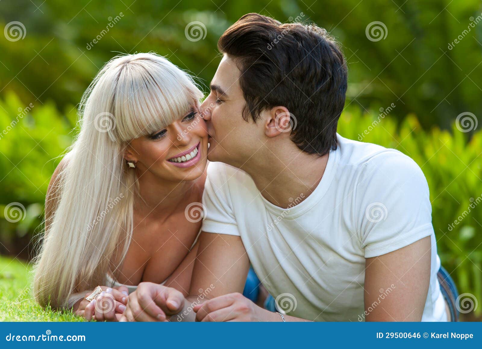 Young Man Kissing Girlfriend On Cheek. Stock Photo Image 29500646