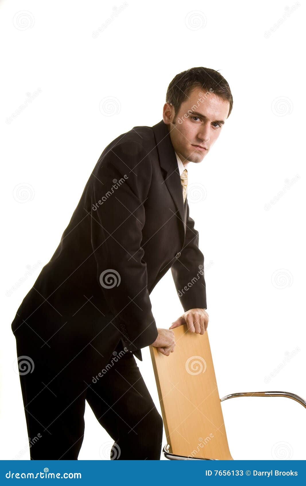 Young Man Leaning On Chair Serious Stock Image - Image: 7656133