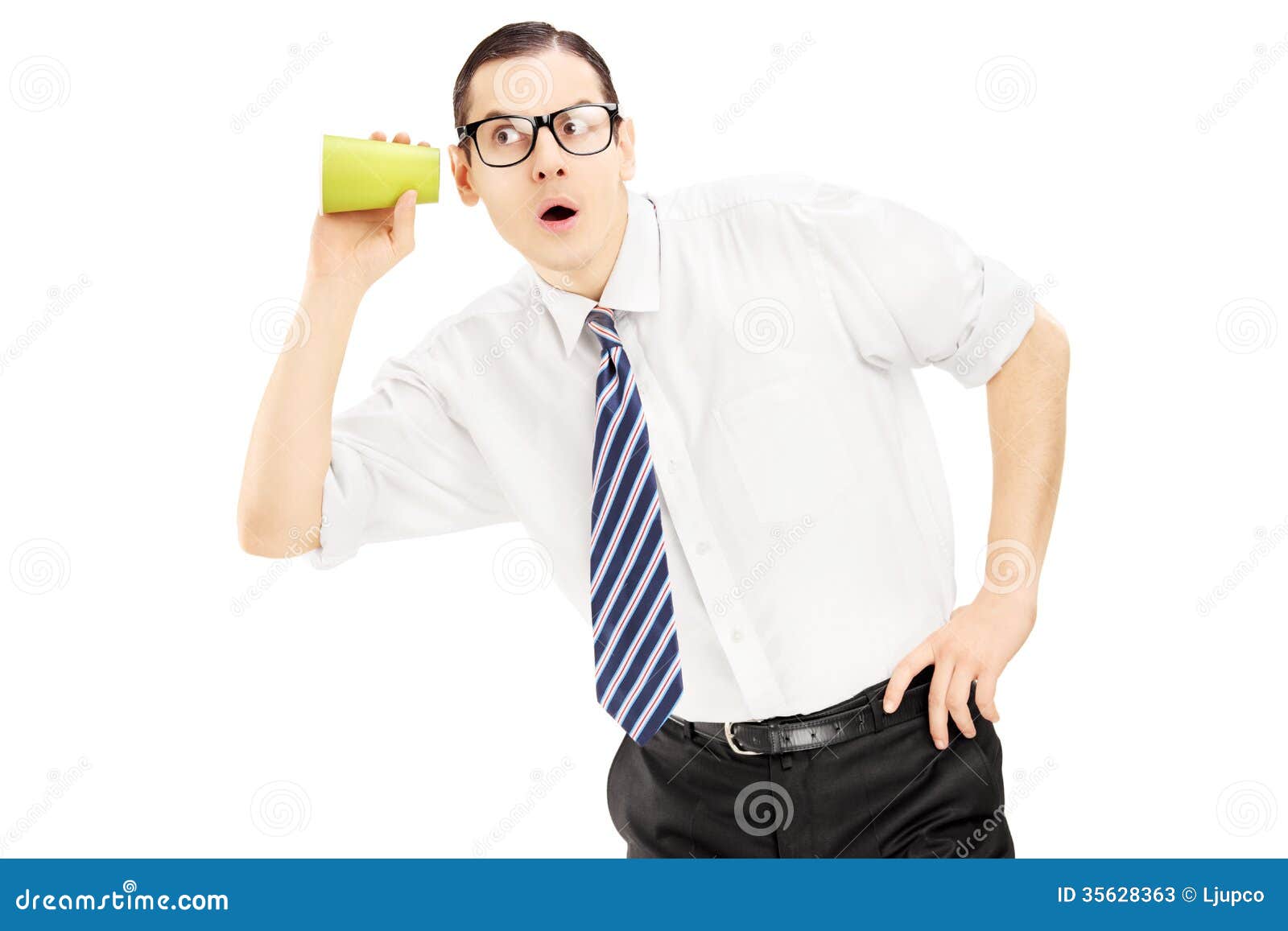 Young Man Listening Through The Wall With A Cup Stock Photos - Image