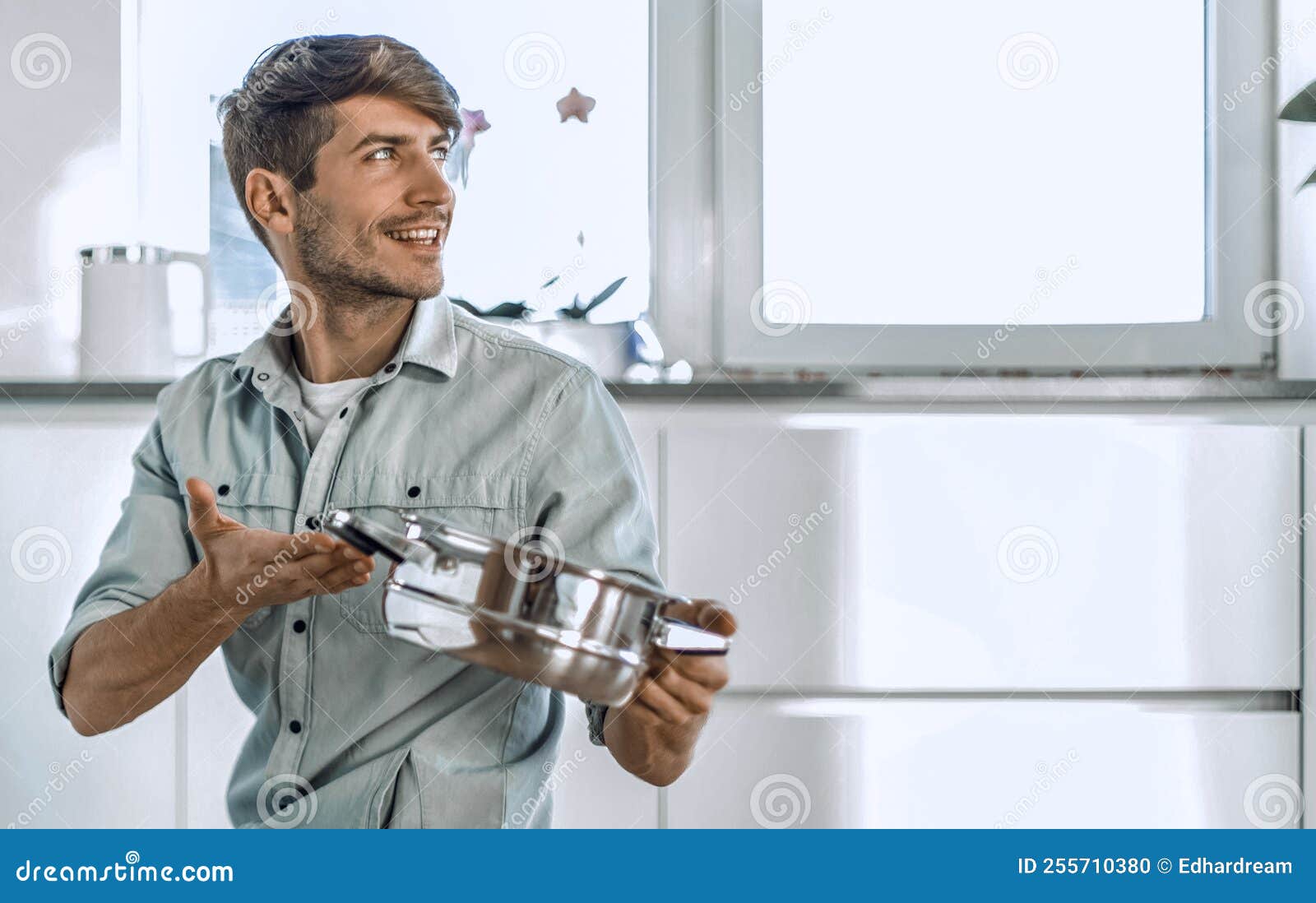 Young Man Looking at Clean Dishes in Dishwasher Stock Photo Image of