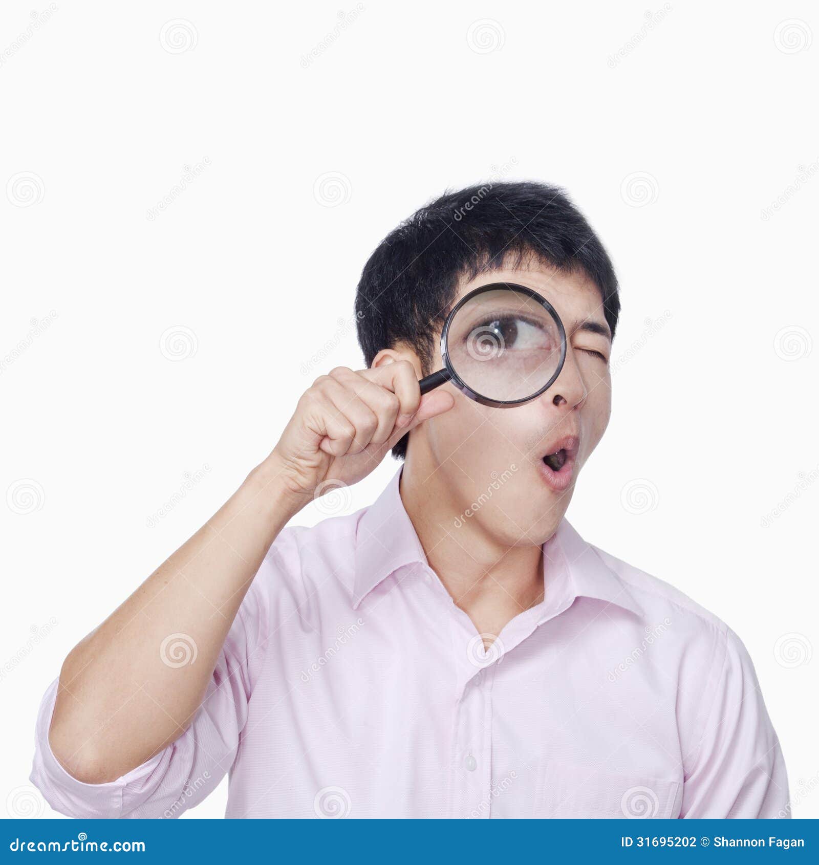 young-man-looking-magnifying-glass-31695202.jpg
