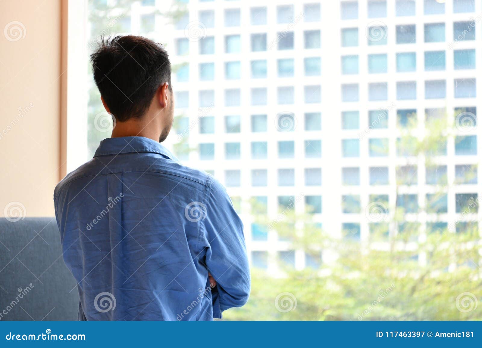 Young man at the window stock photo. Image of casual - 30207172