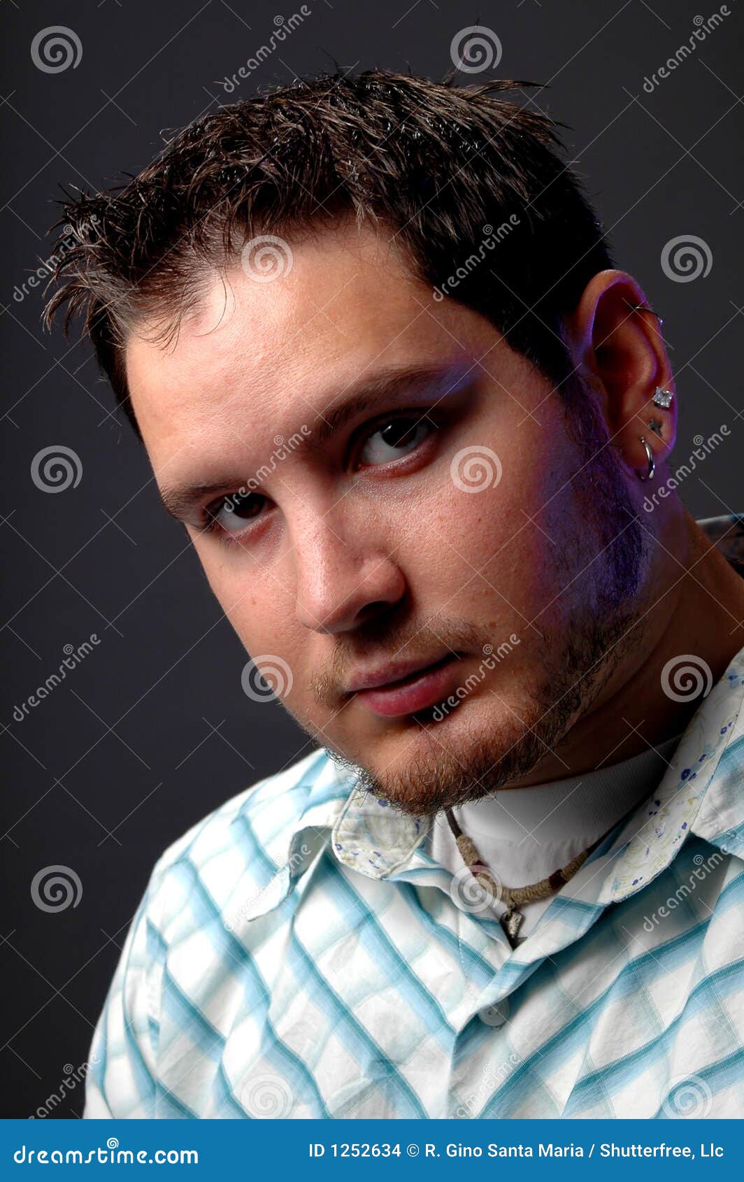 Young Man Looking Serious stock photo. Image of relaxed - 1252634