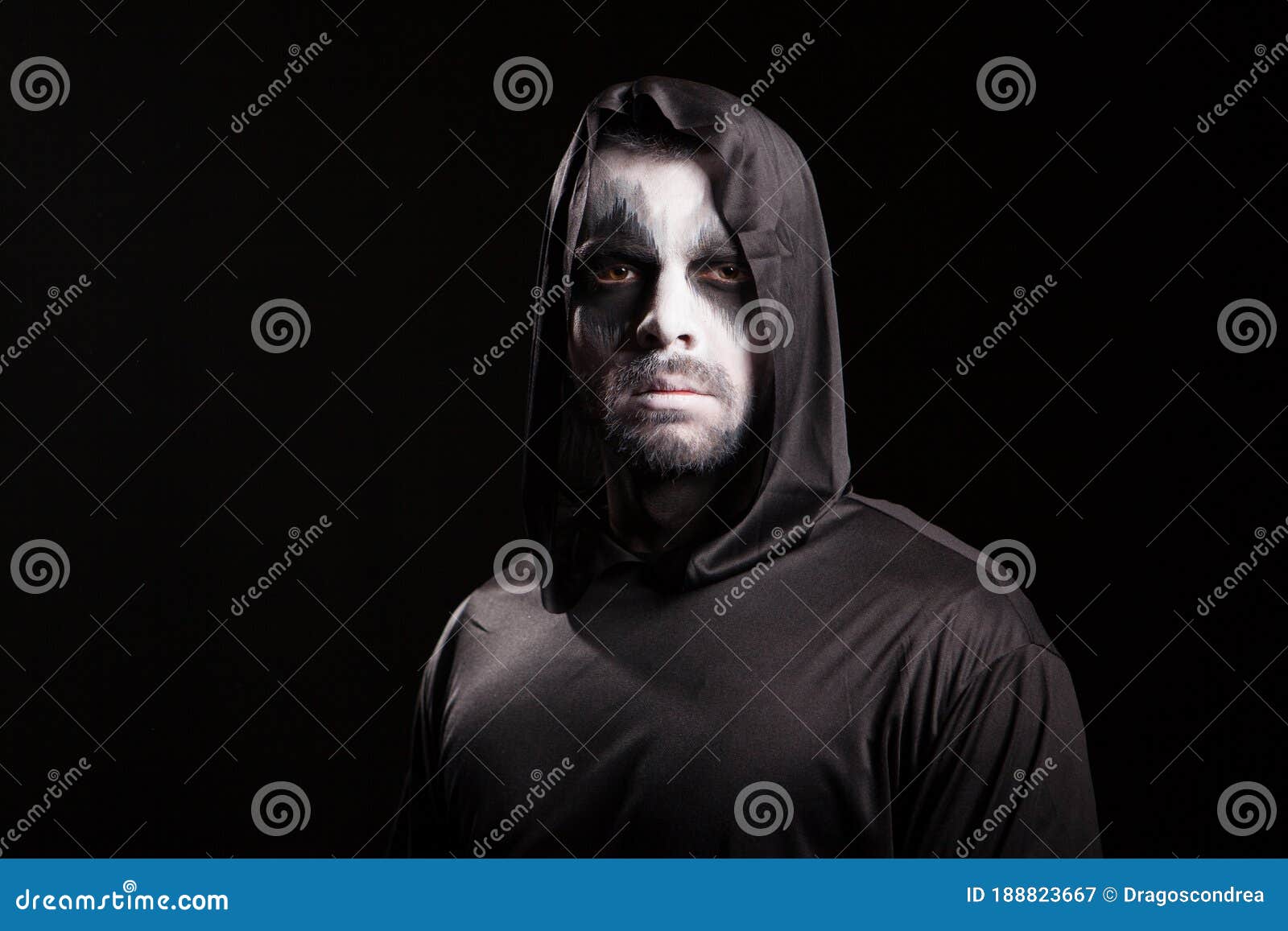 Young Man Looking Serious into the Camera Dressed Up Like Grim Reaper ...