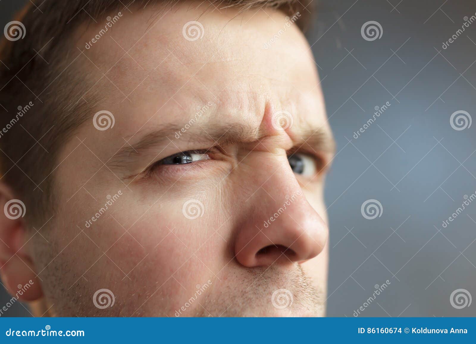 Angry man frowns his face stock photo. Image of beautiful - 86160674