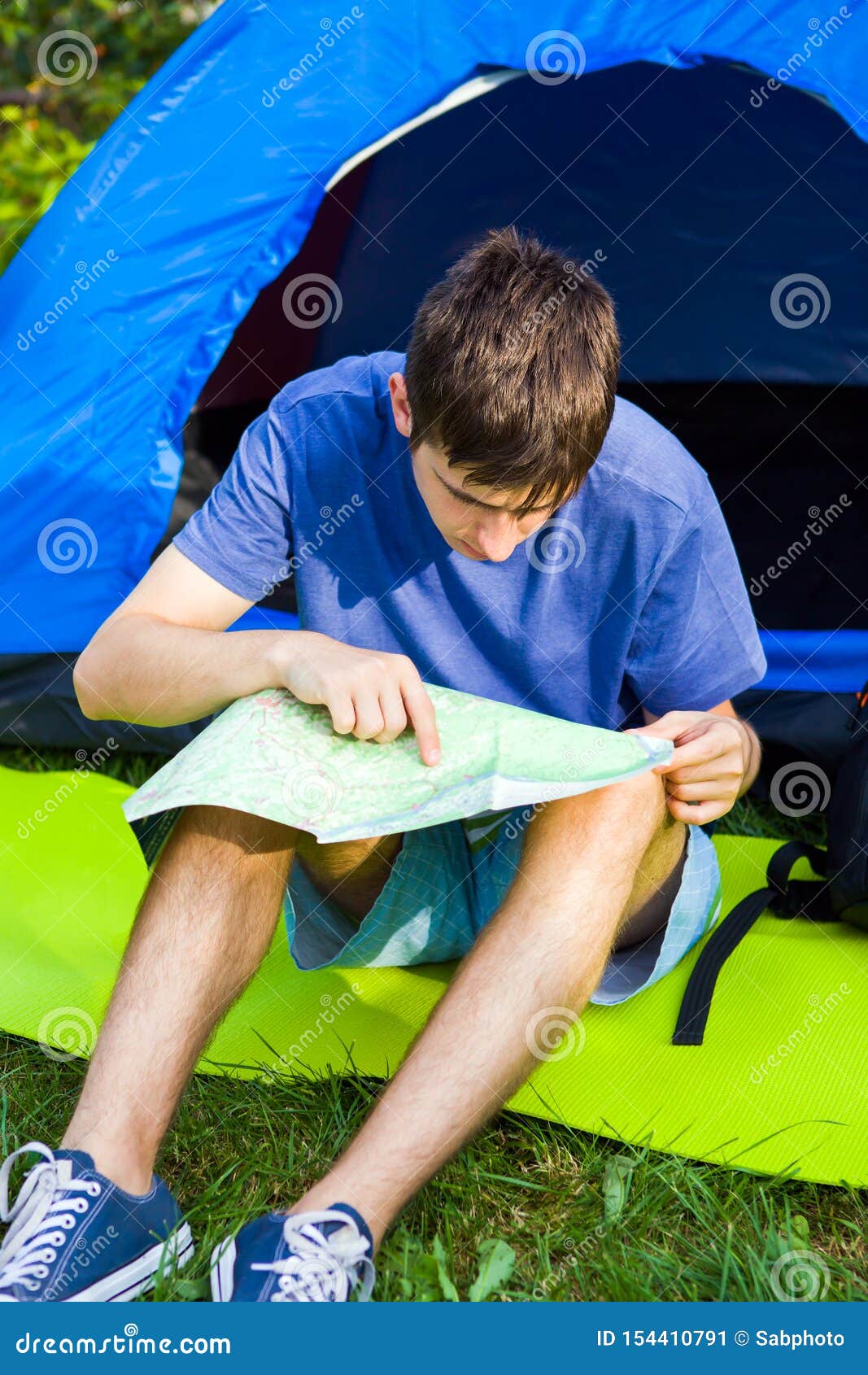 Young Man with a Map stock image. Image of looking, orientation - 154410791