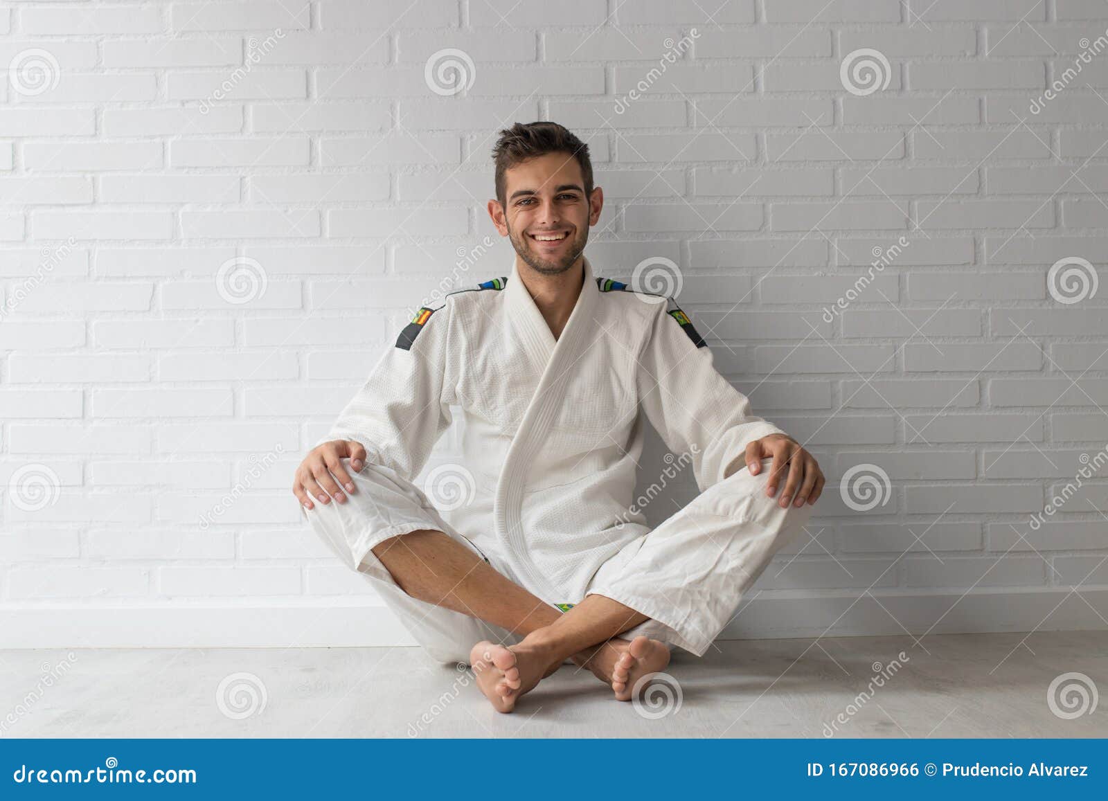 Young Man in Martial Arts Uniform Sitting Stock Photo Image of karate