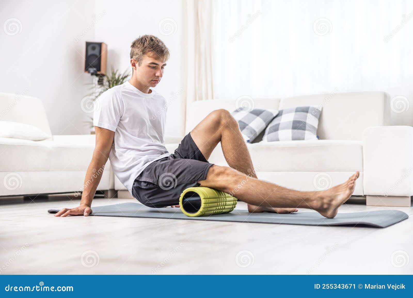 Young Man Massage Thigh Muscle with Foam Roller Stock Image Image of