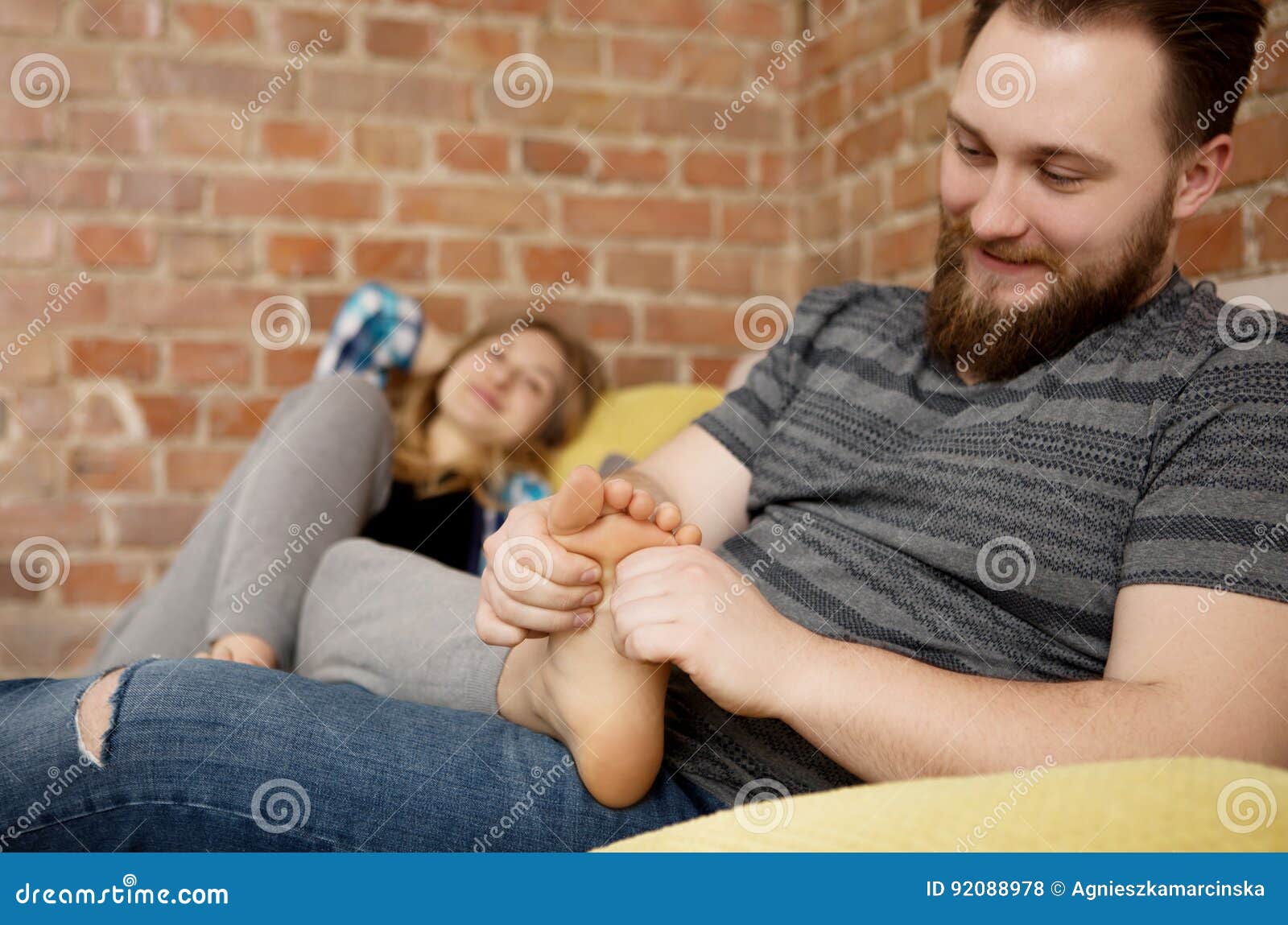 Young Man Massaging His Lovers Feet Stock Photo Image Of Pregn