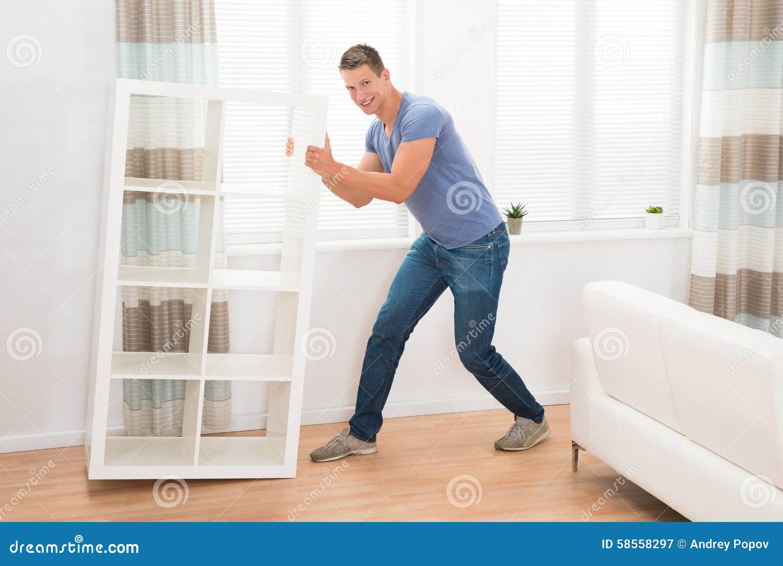 Young Man Moving Shelf stock image. Image of move, blind 58558297
