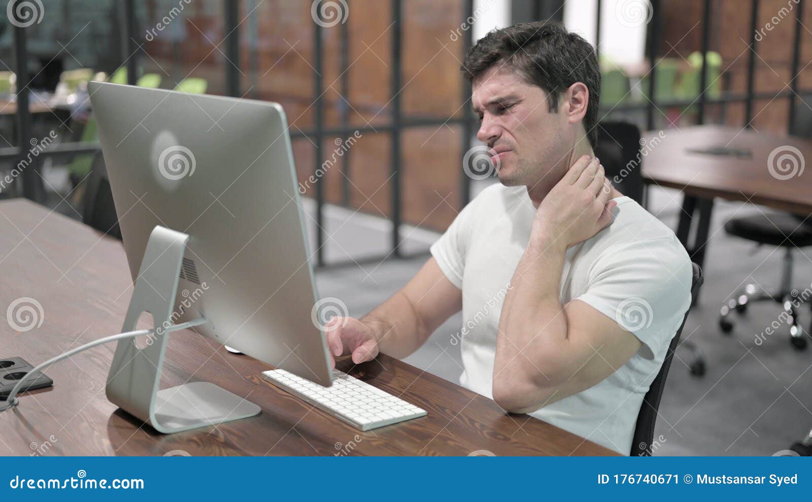 Young Man with Neck Pain at Work Stock Image Image of pain, tired