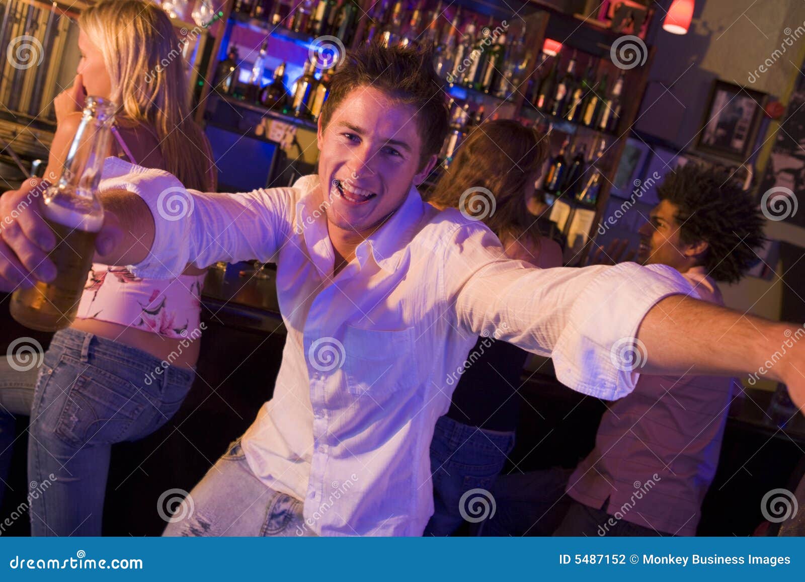 Young man in stock photo. Image of holding, bottle 5487152