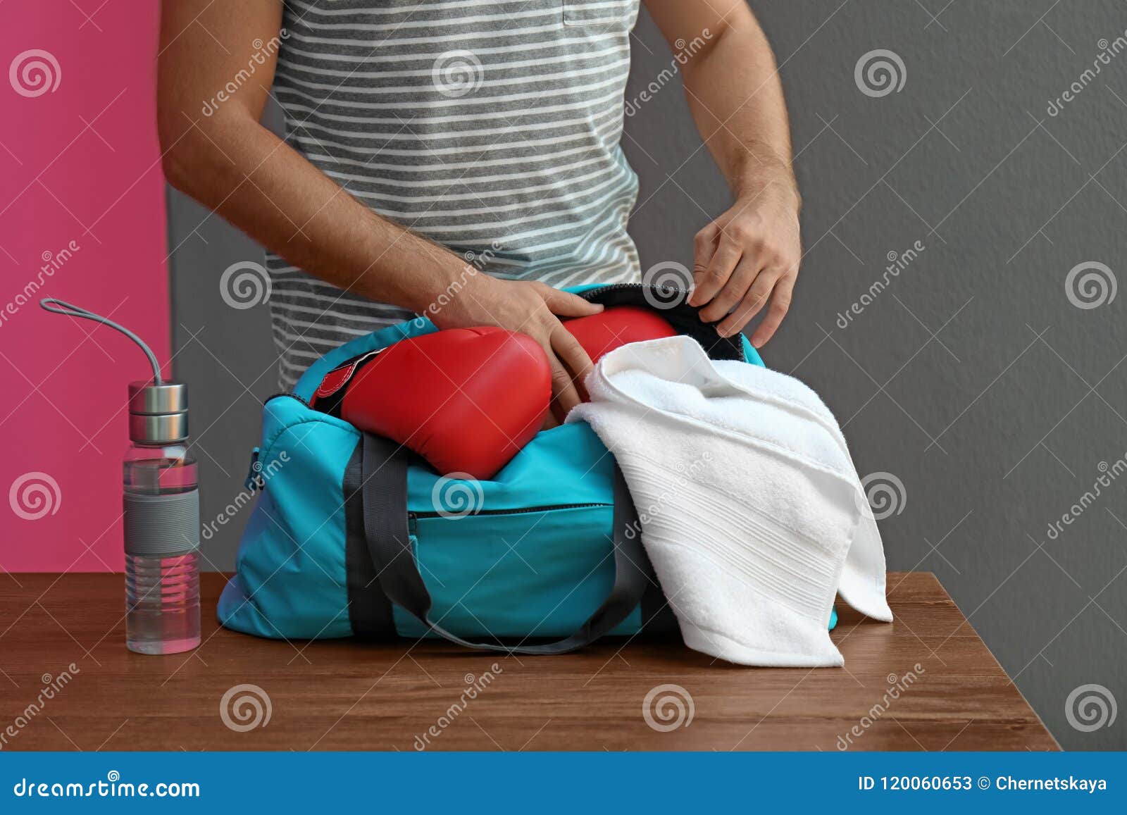 Young Man Packing Sports Bag Stock Image - Image of full, towel: 120060653