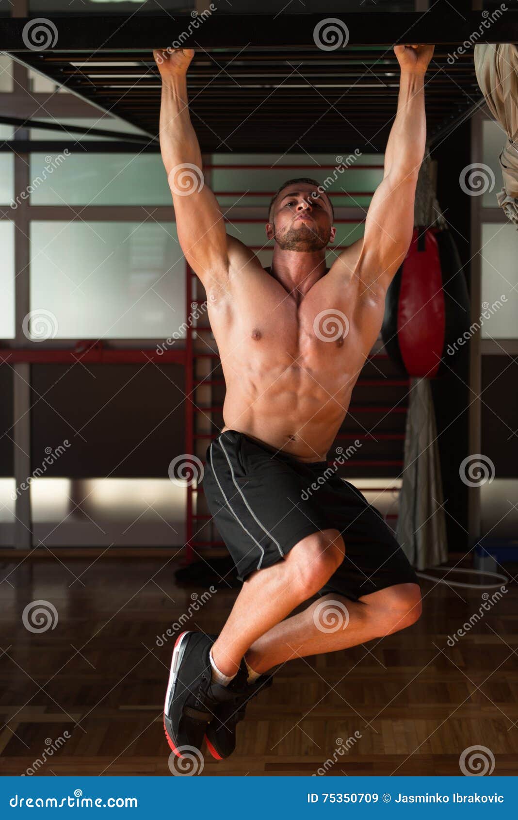 Young Man Performing Hanging Leg Raises Abs Exercise Stock Image - Image of  mature, muscular: 75350709