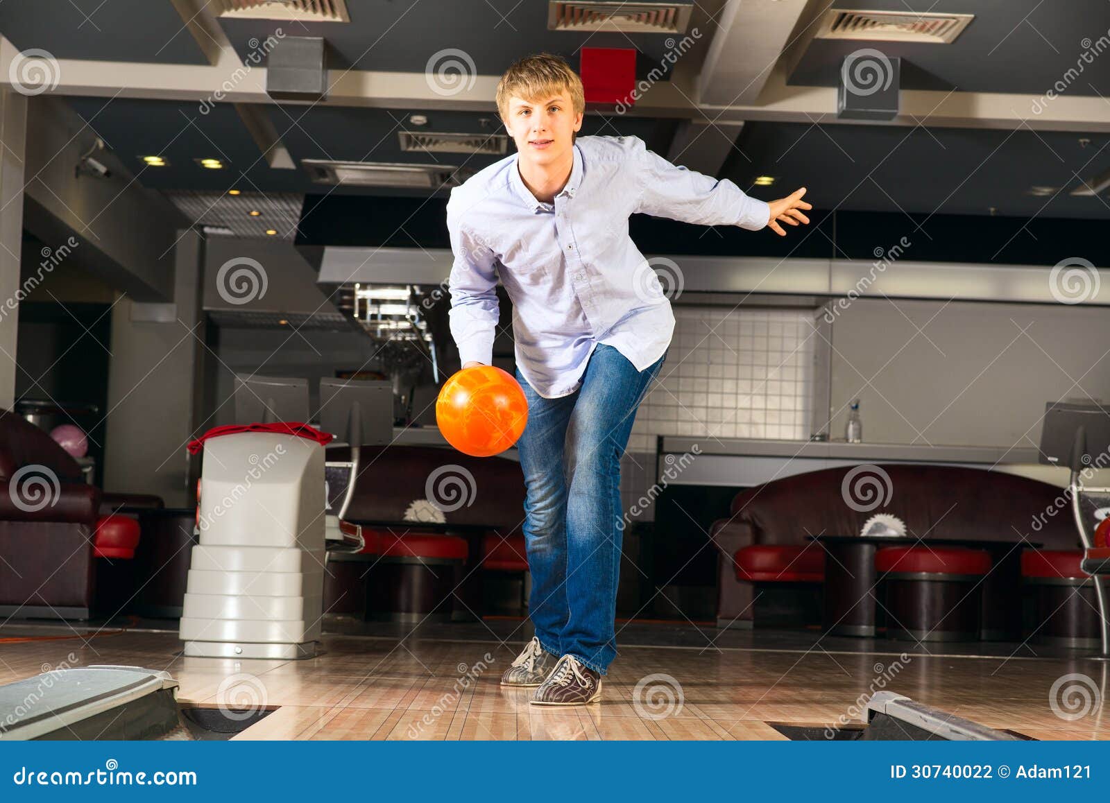 Young man playing bowling stock photo. Image of lifestyle 30740022