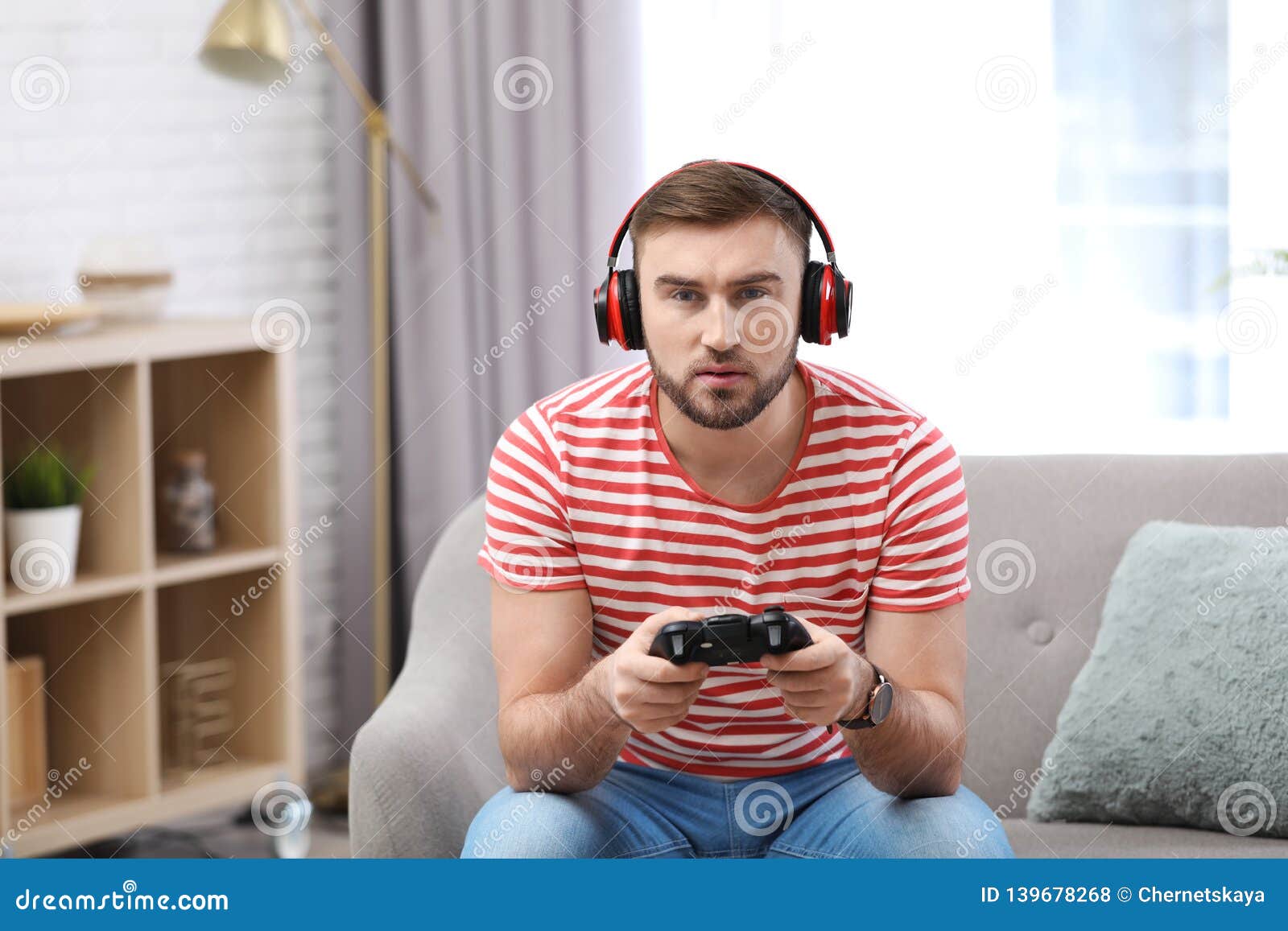 186 Sitting On Ground Playing Video Games Stock Photos, High-Res