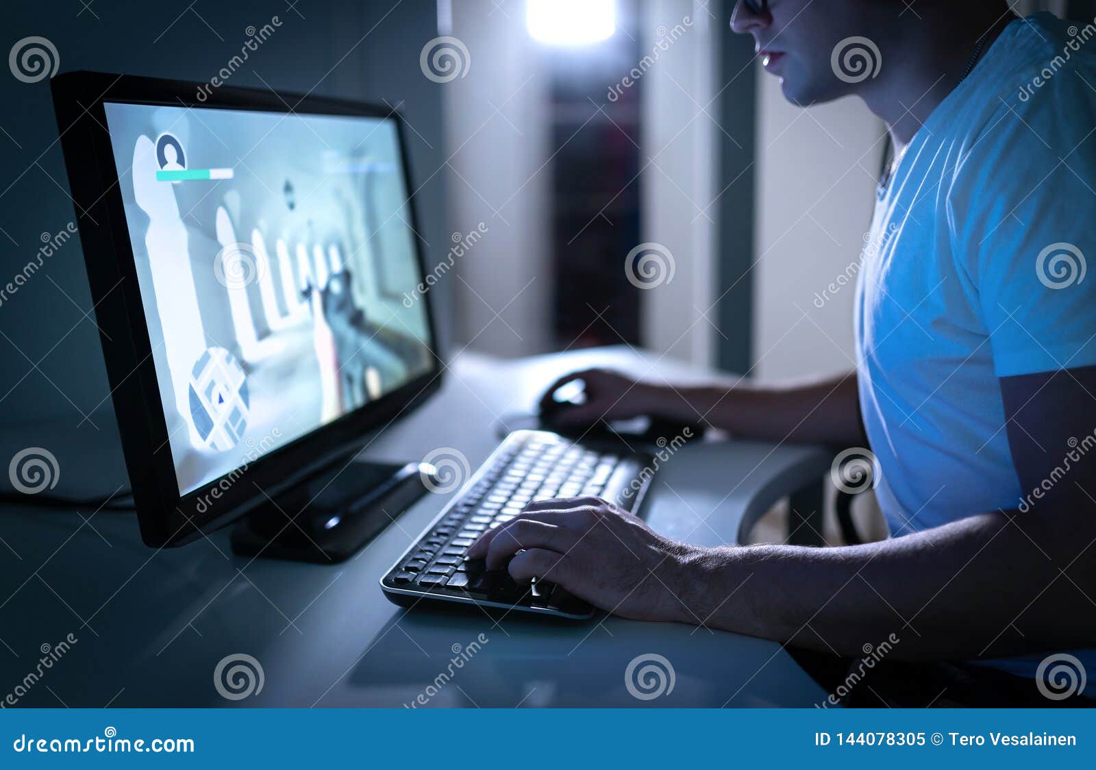 young man playing video game late at night at home. gamer streaming fps videogame online. first person shooter.