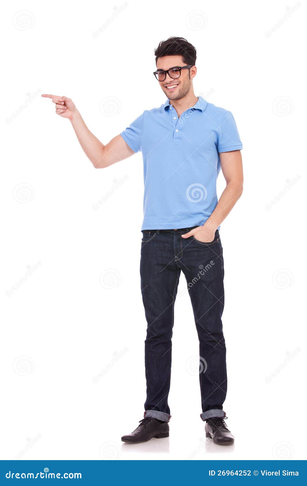 Young Man Pointing With A Hand In Pocket Stock Photography Image