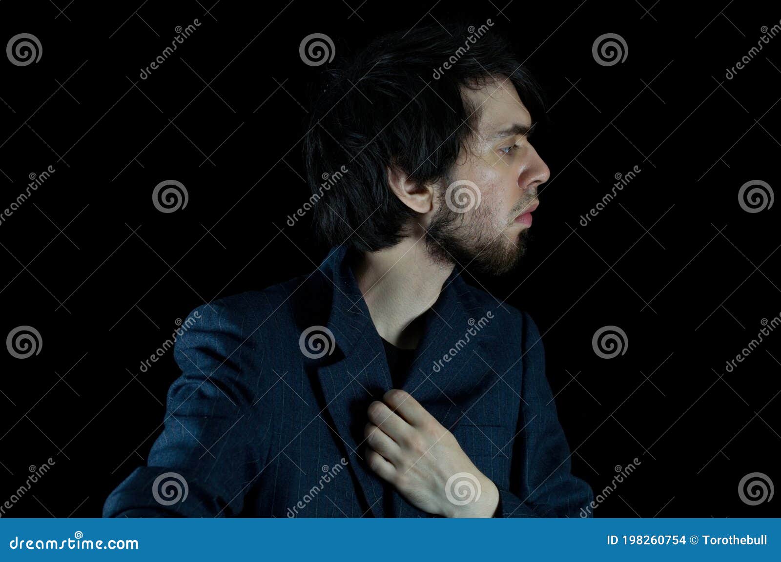 Young Man Posing for a Side Portrait Shot Stock Photo - Image of people ...