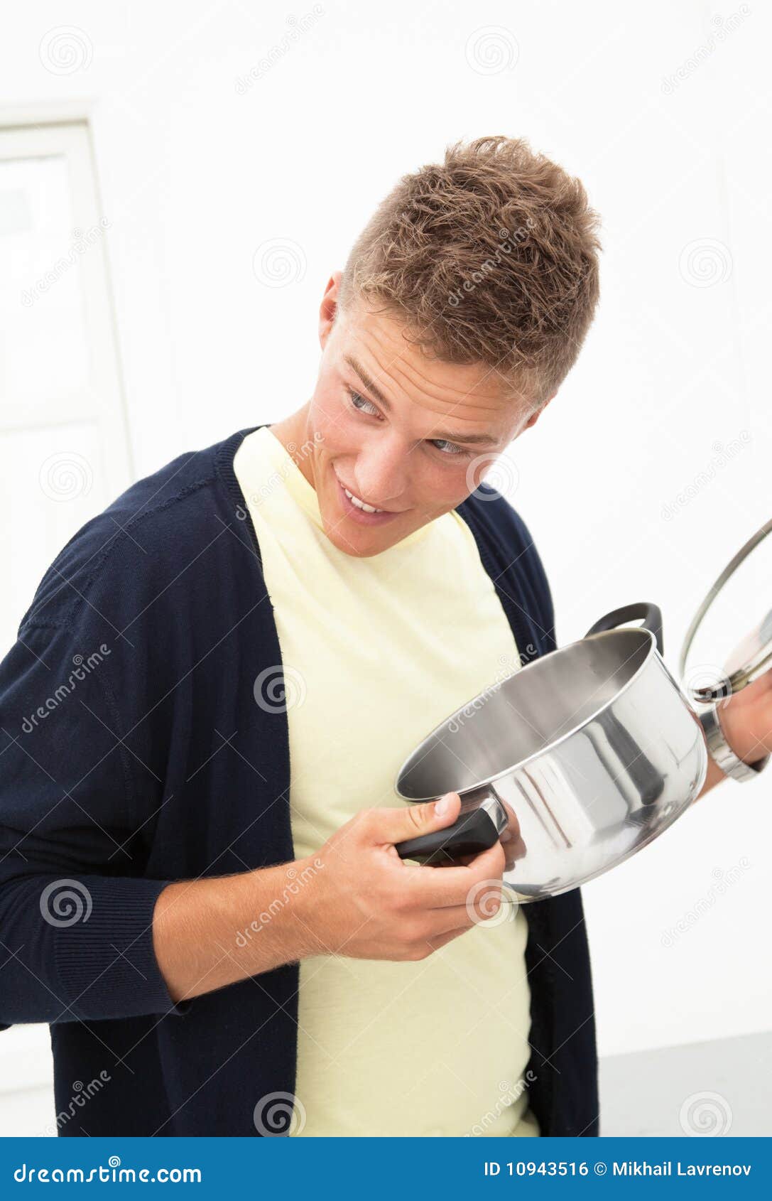 Young man with pot stock photo. Image of turn, kitchen 10943516