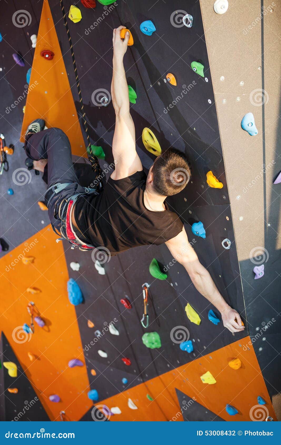 Young Man Practicing Rockclimbing in Climbing Gym Stock Photo Image