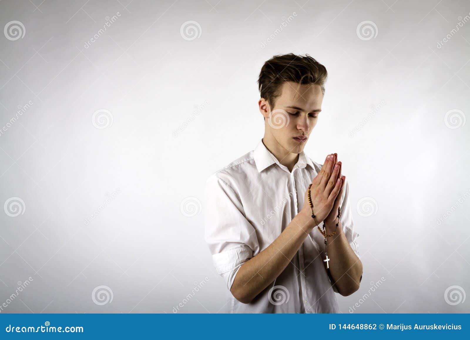 Young Man is Praying with Rosary Beads Stock Photo - Image of look