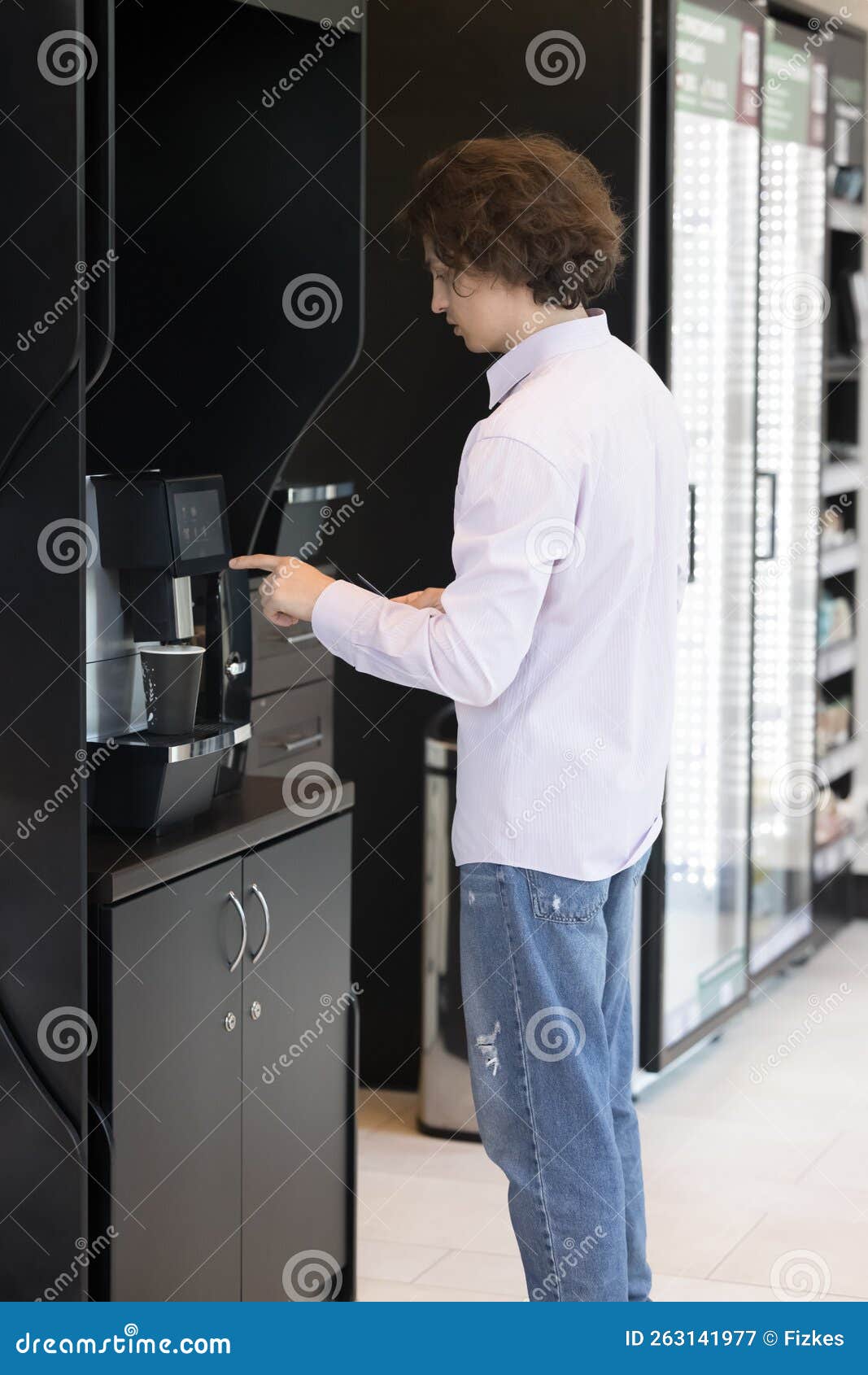 Young Man Prepare Coffee Using Professional Vending Machine Stock Image