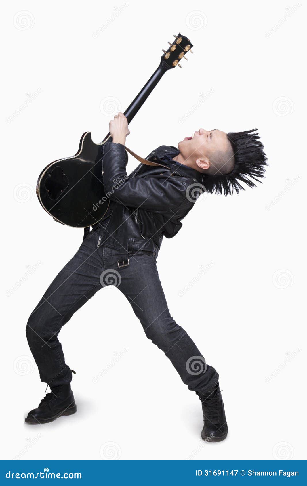 young man with punk mohawk playing guitar