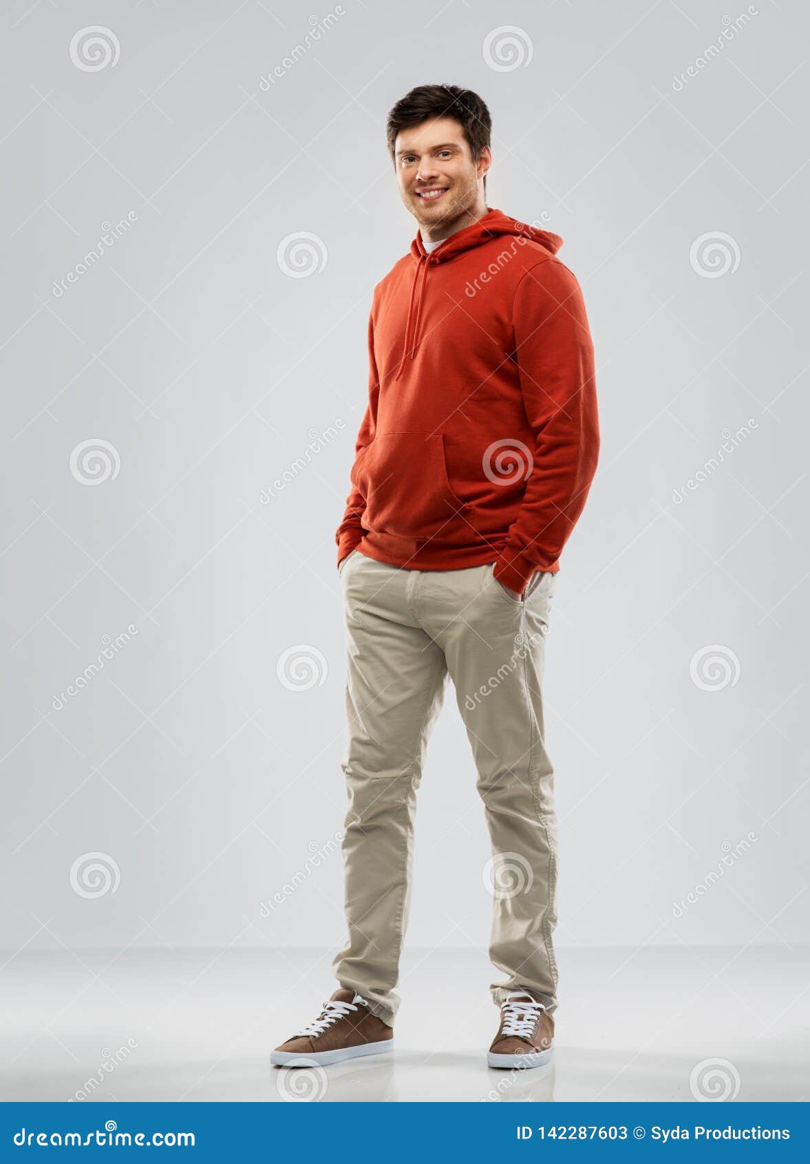 Young Man in Red Hoodie Over Grey Background Stock Image - Image of ...