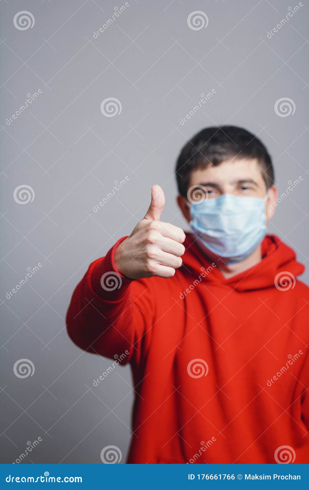 Young Man in Red Sweatshirt Wearing a Protective Mask on His Face and ...