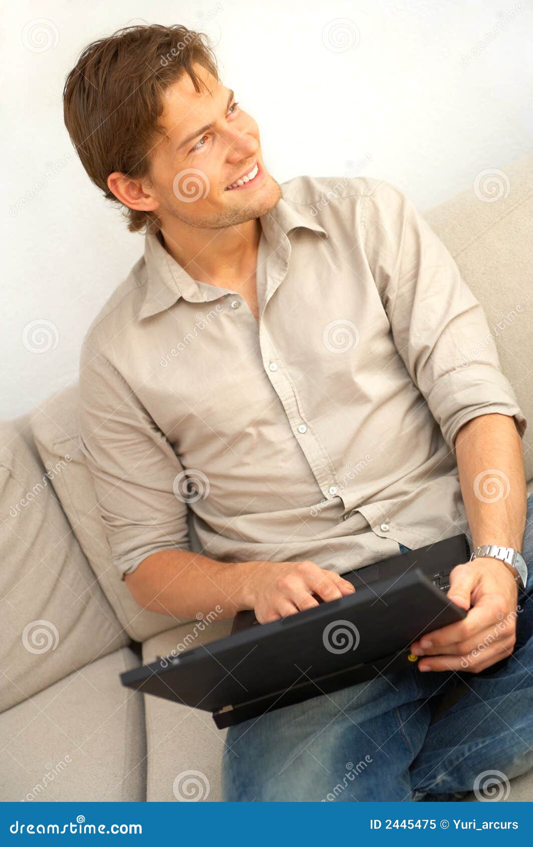 Young Man Relaxing with Laptop Stock Image Image of interior