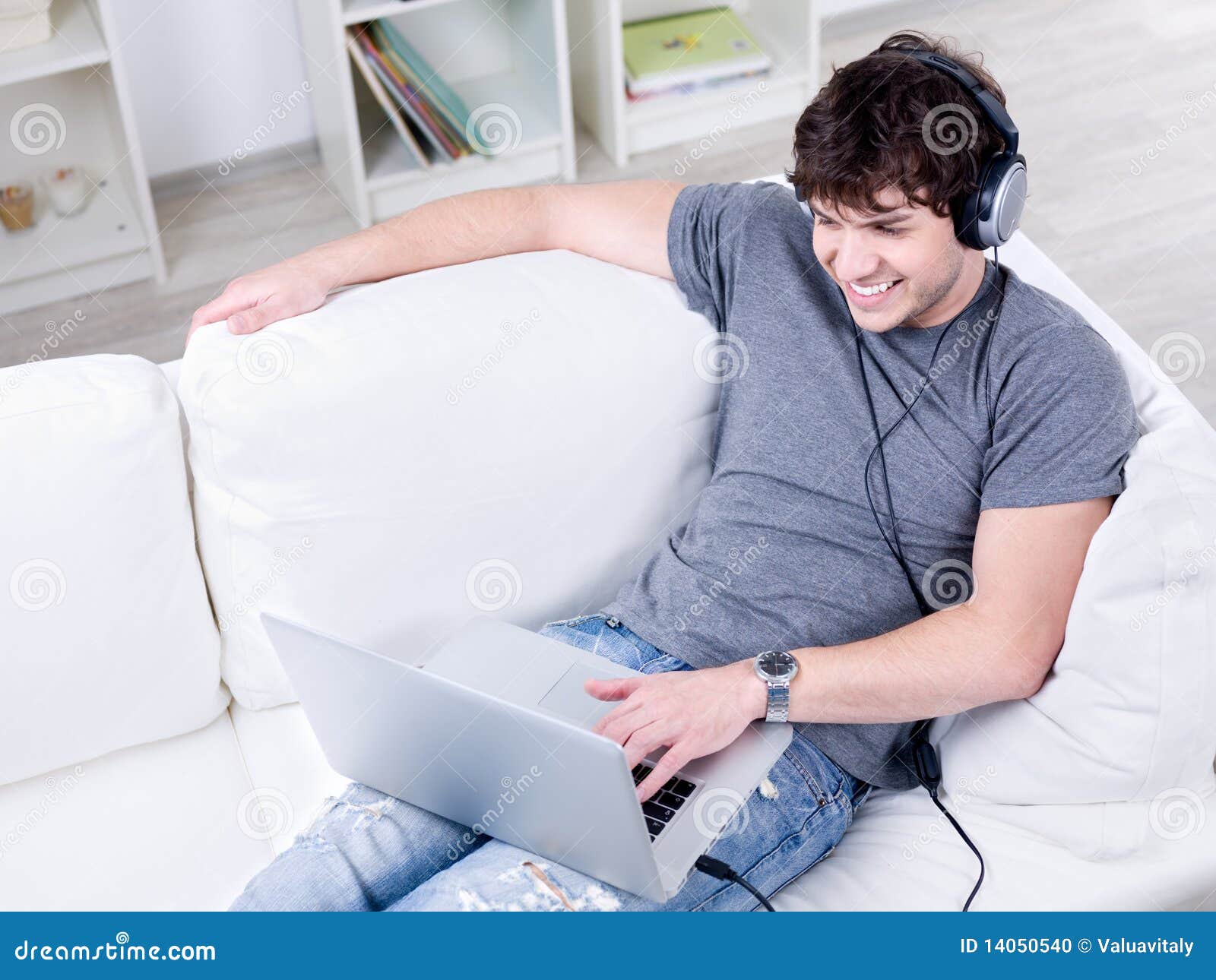 Young Man Relaxing with Laptop and Headset Stock Photo Image of