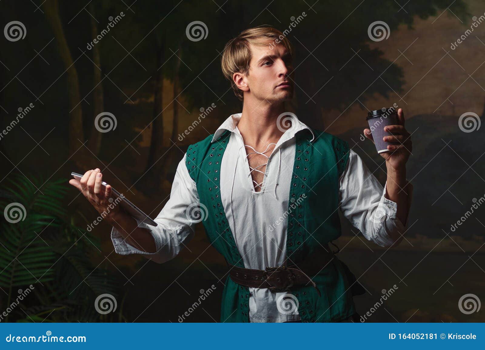 young man in renaissance style uses gadgets.