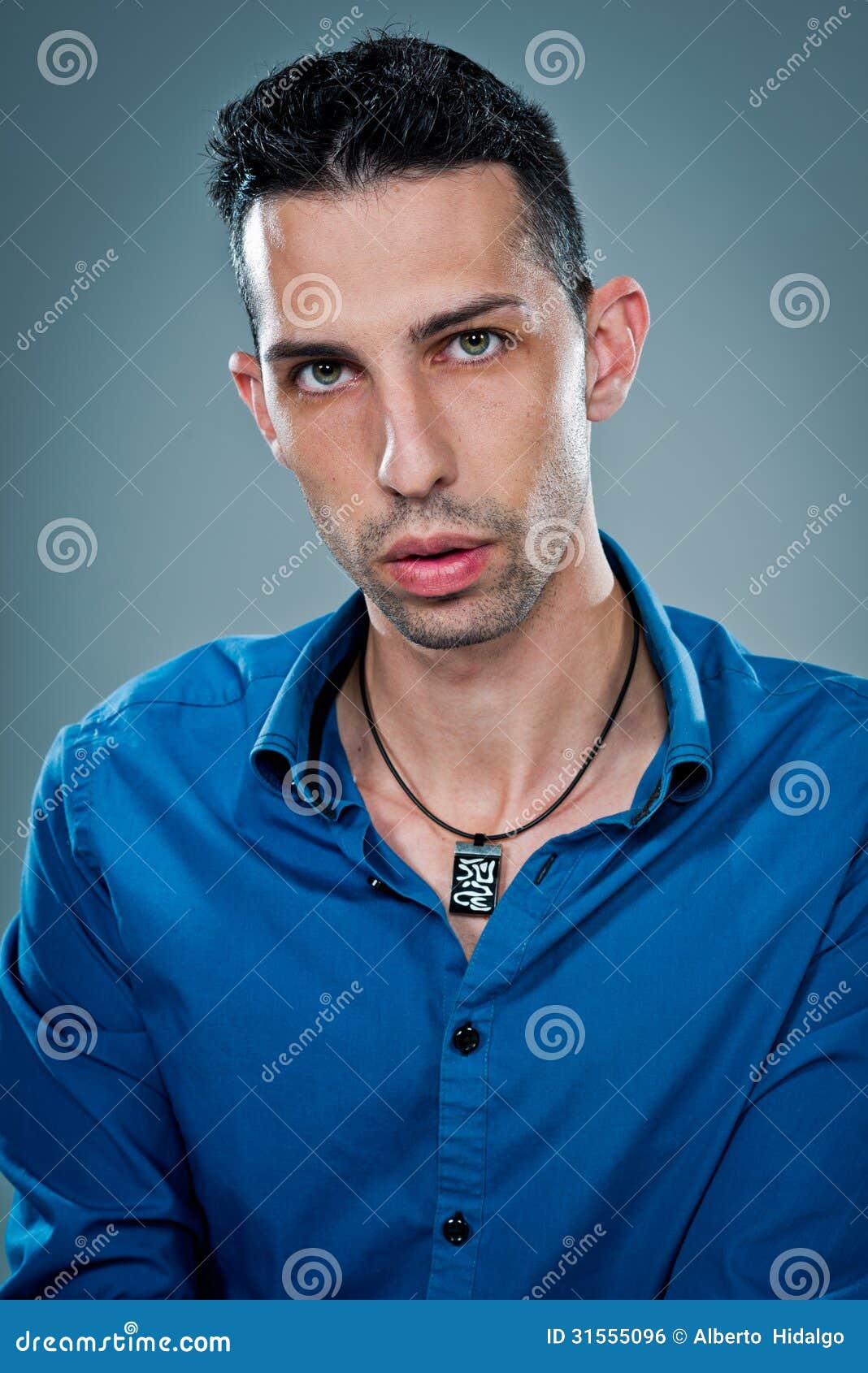 Young Man with Serious Expression Stock Photo - Image of hair, camera ...