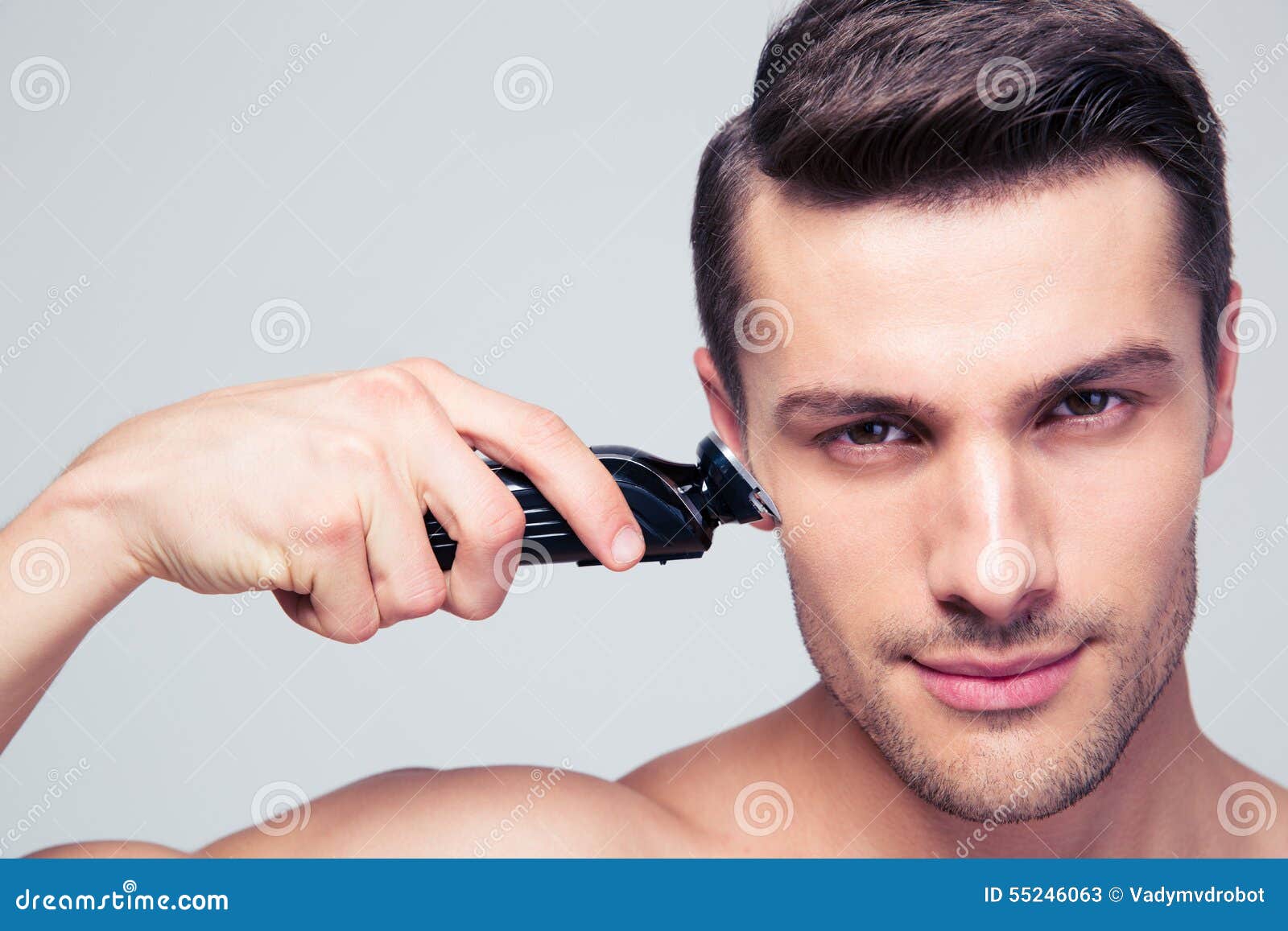 Young Man Shaving with Electric Razor Stock Image Image of lifestyles