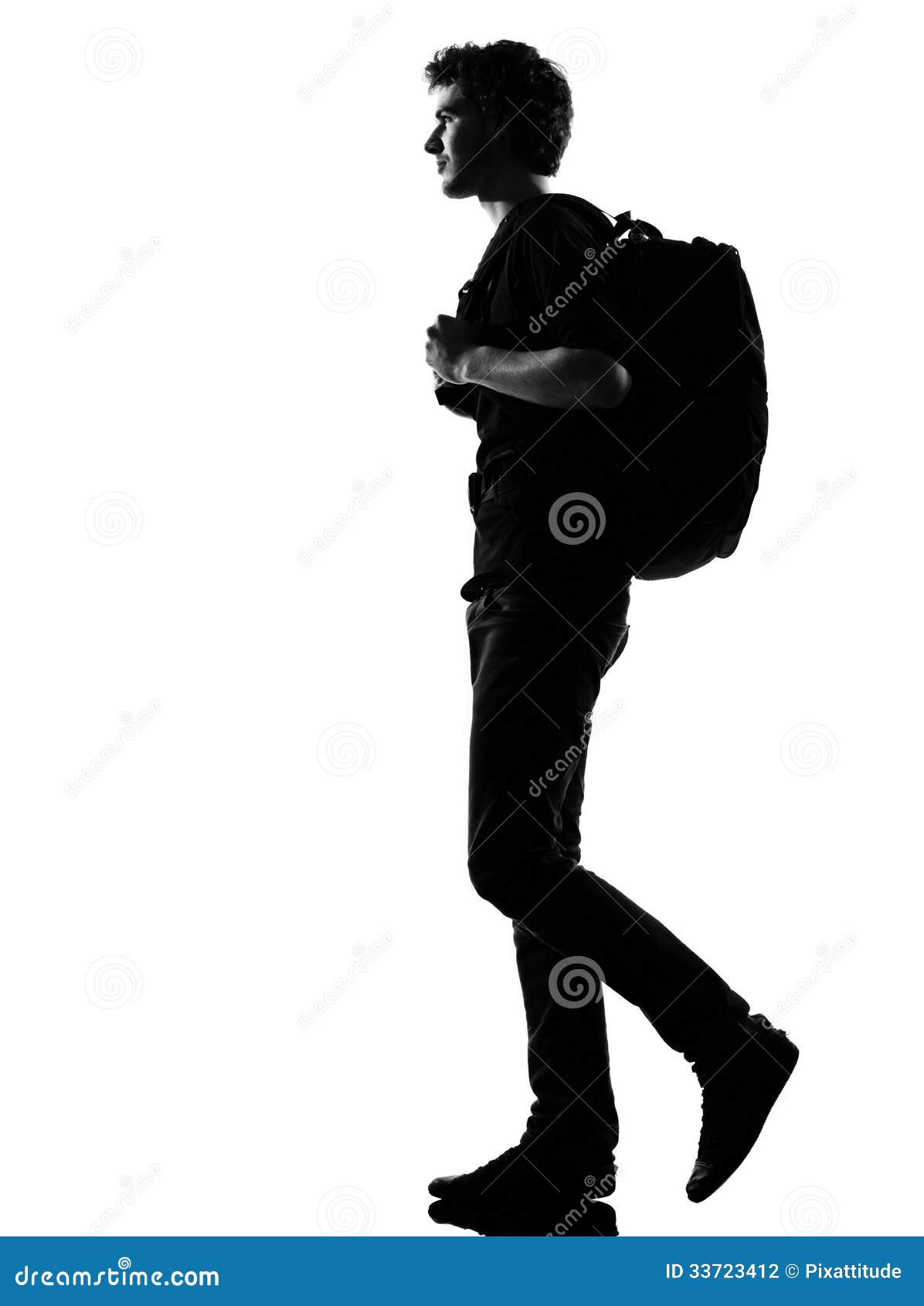 young man silhouette backpacker walking