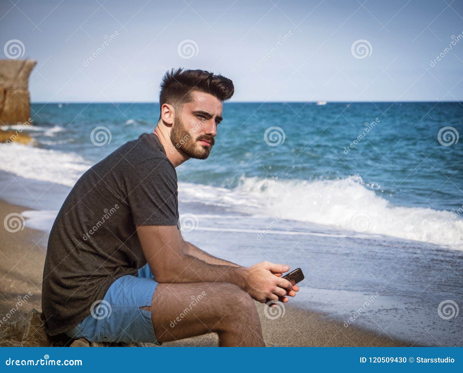 Young Man Sitting On A Beach Alone And Lonely Stock Photo Image Of Hand Outdoor