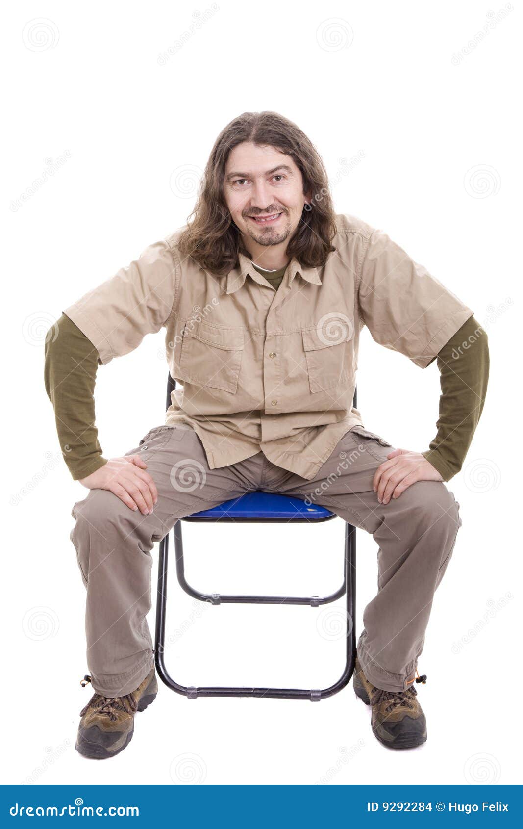 Young Man Sitting On A Chair Stock Photo Image of