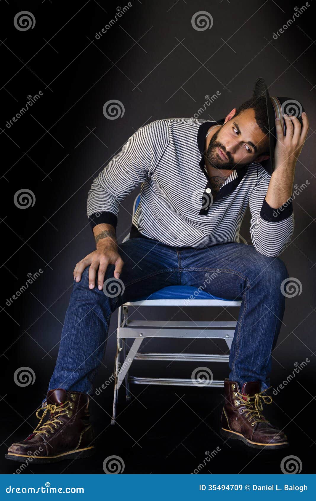 Young Man Sitting On A Chair Royalty Free Stock Images - Image: 35494709