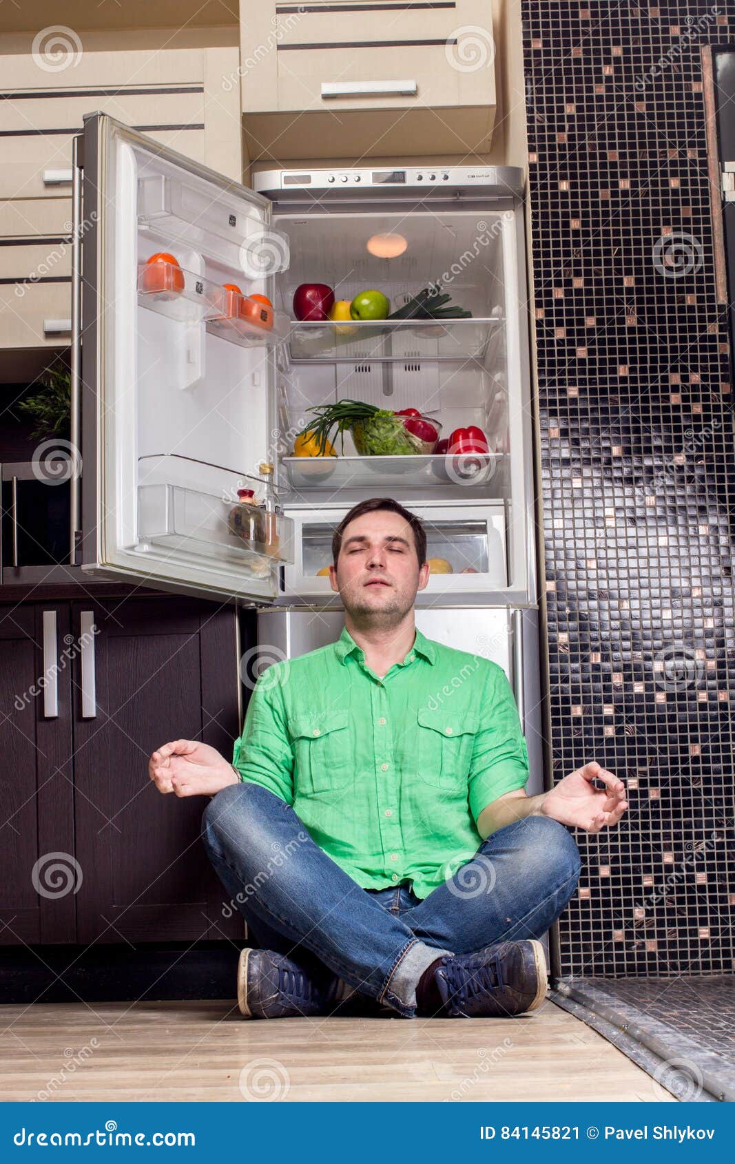 Young Man Sitting in Front of Fridge Stock Image Image of open