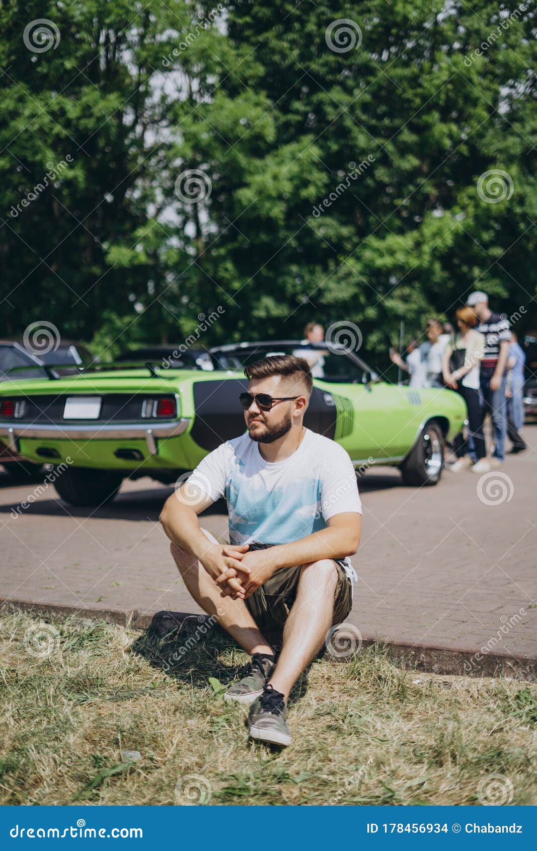 Young Man Sitting on Green Car Background Stock Photo - Image of beauty,  green: 178456934