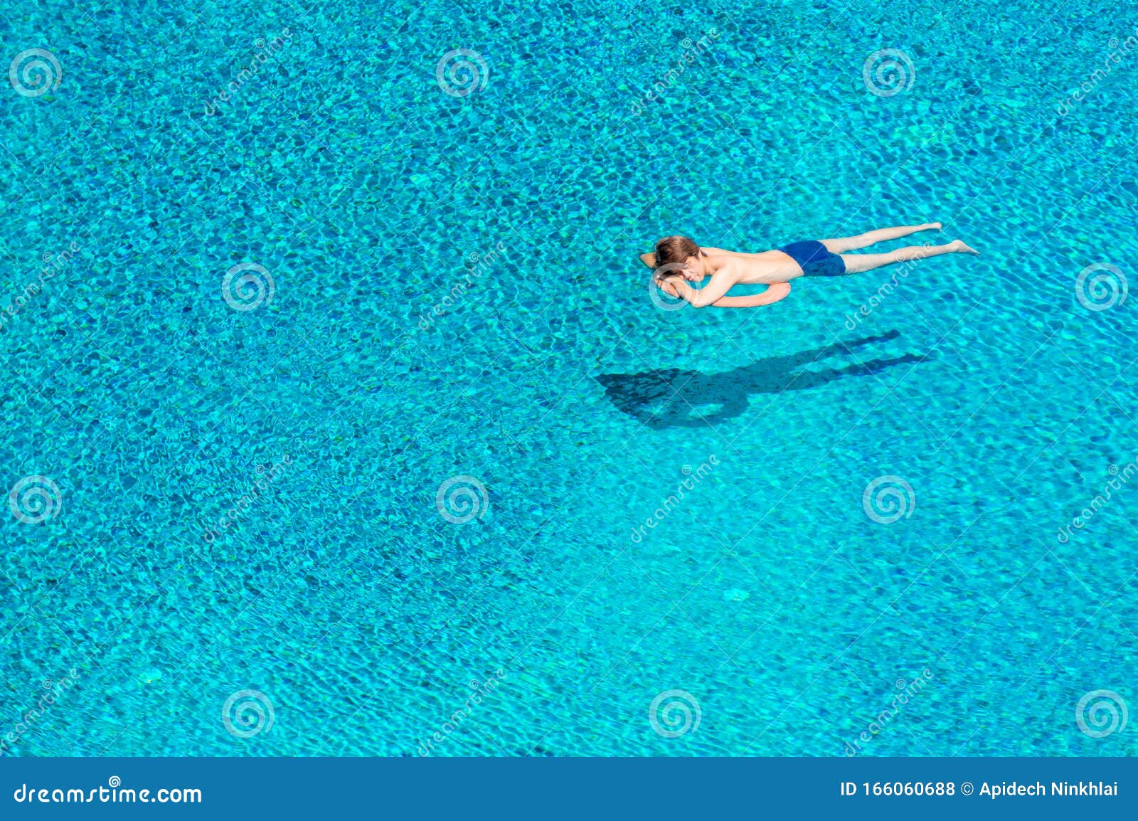 Young Man Sleeping on Lifebuoy in Swimming Pool Stock Photo - Image of ...