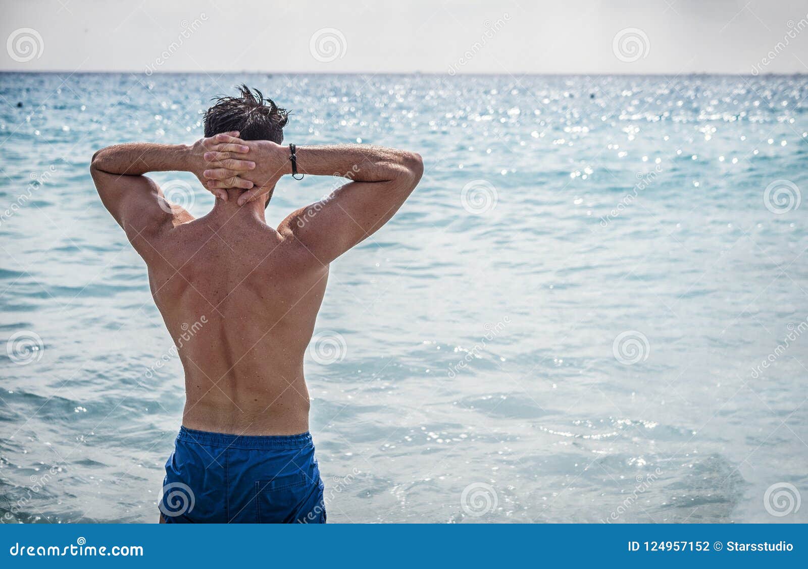Young Man Standing On A Beach Taking A Bath Stock Photo Image Of
