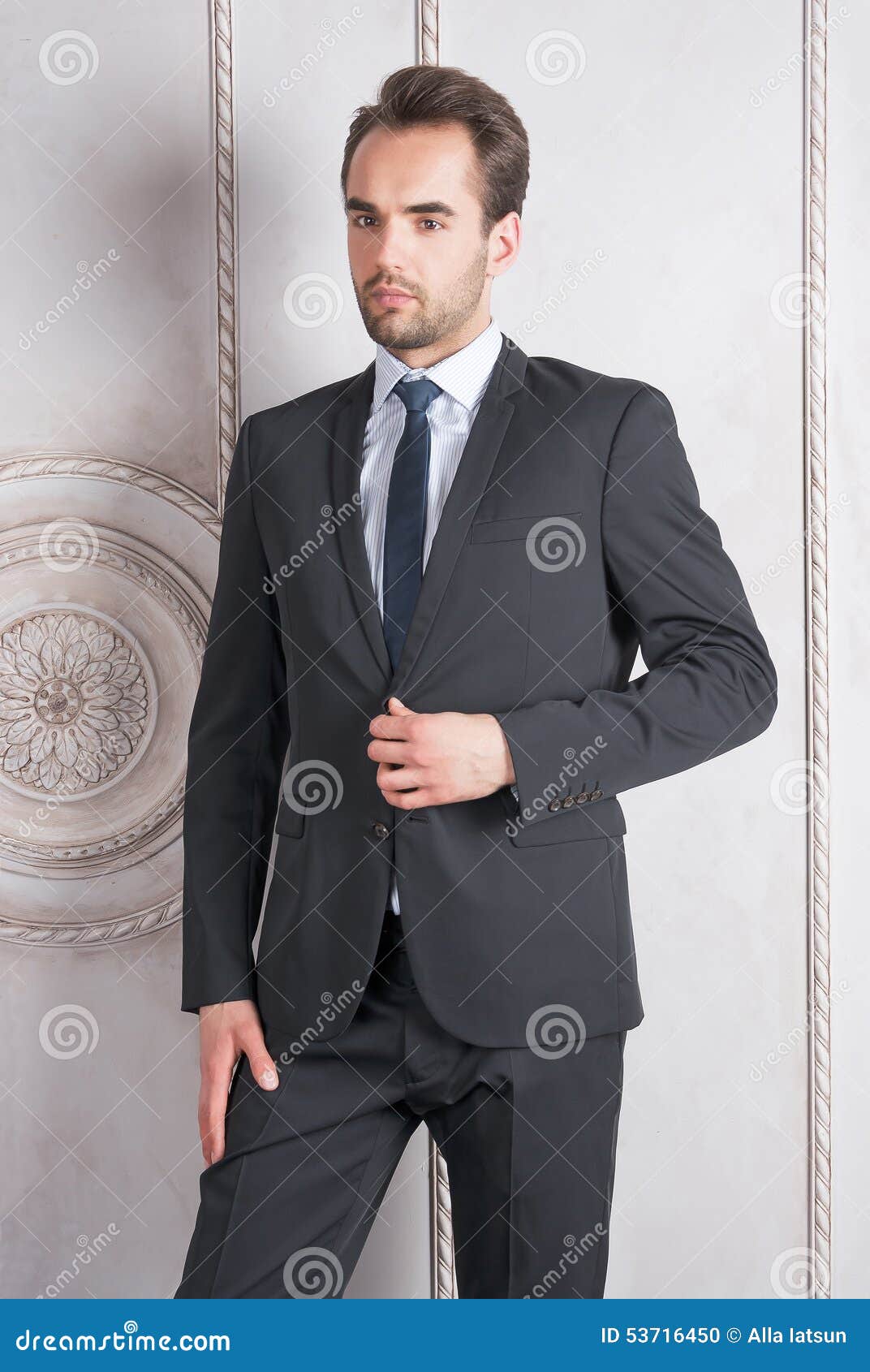Young Man Standing in Front of a Wall Stock Photo - Image of business ...