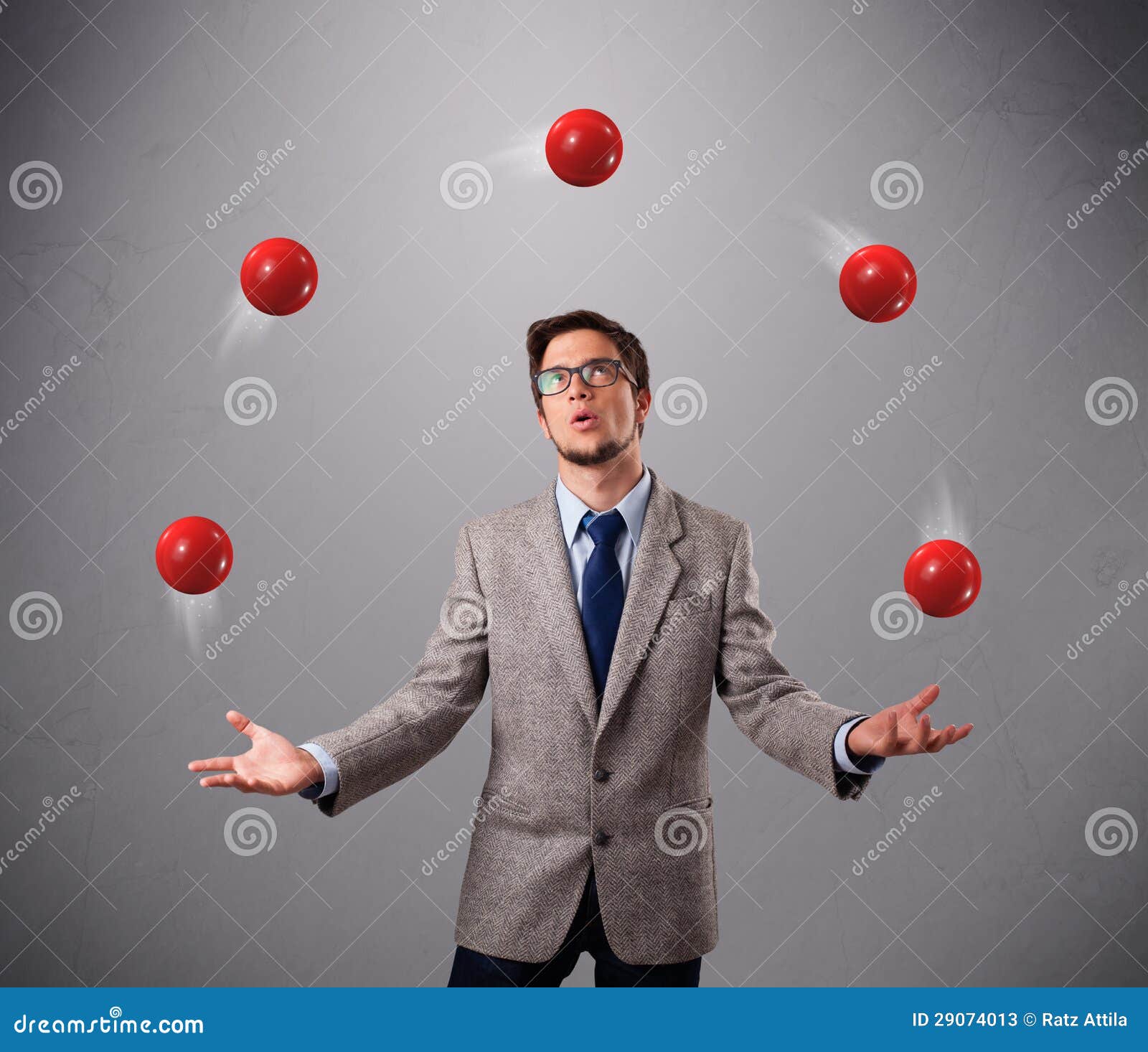 Young Man Standing And Juggling With Red Balls Stock Photos - Image