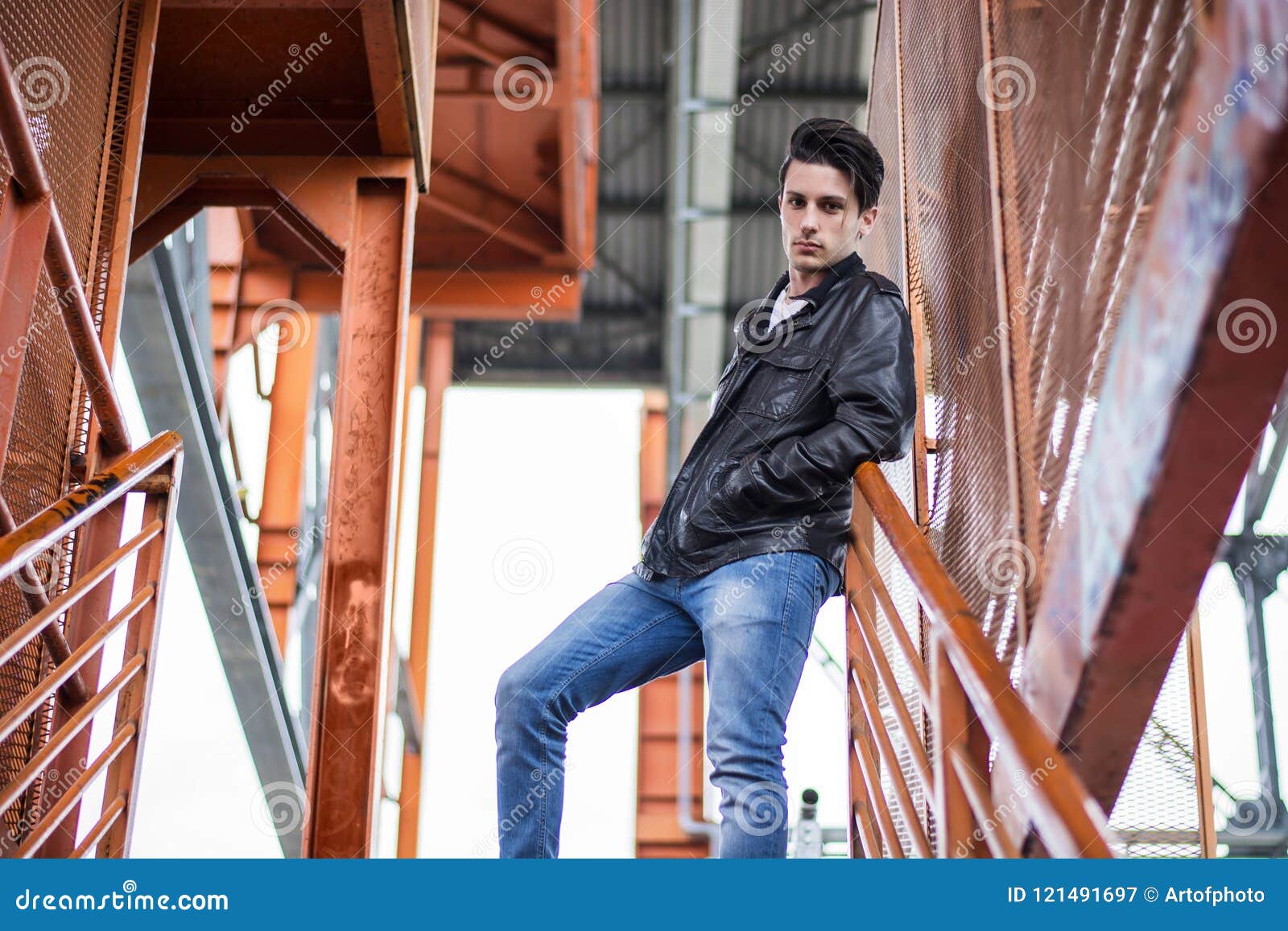 Young Man Standing Outdoors in Urban Setting Stock Image - Image of ...