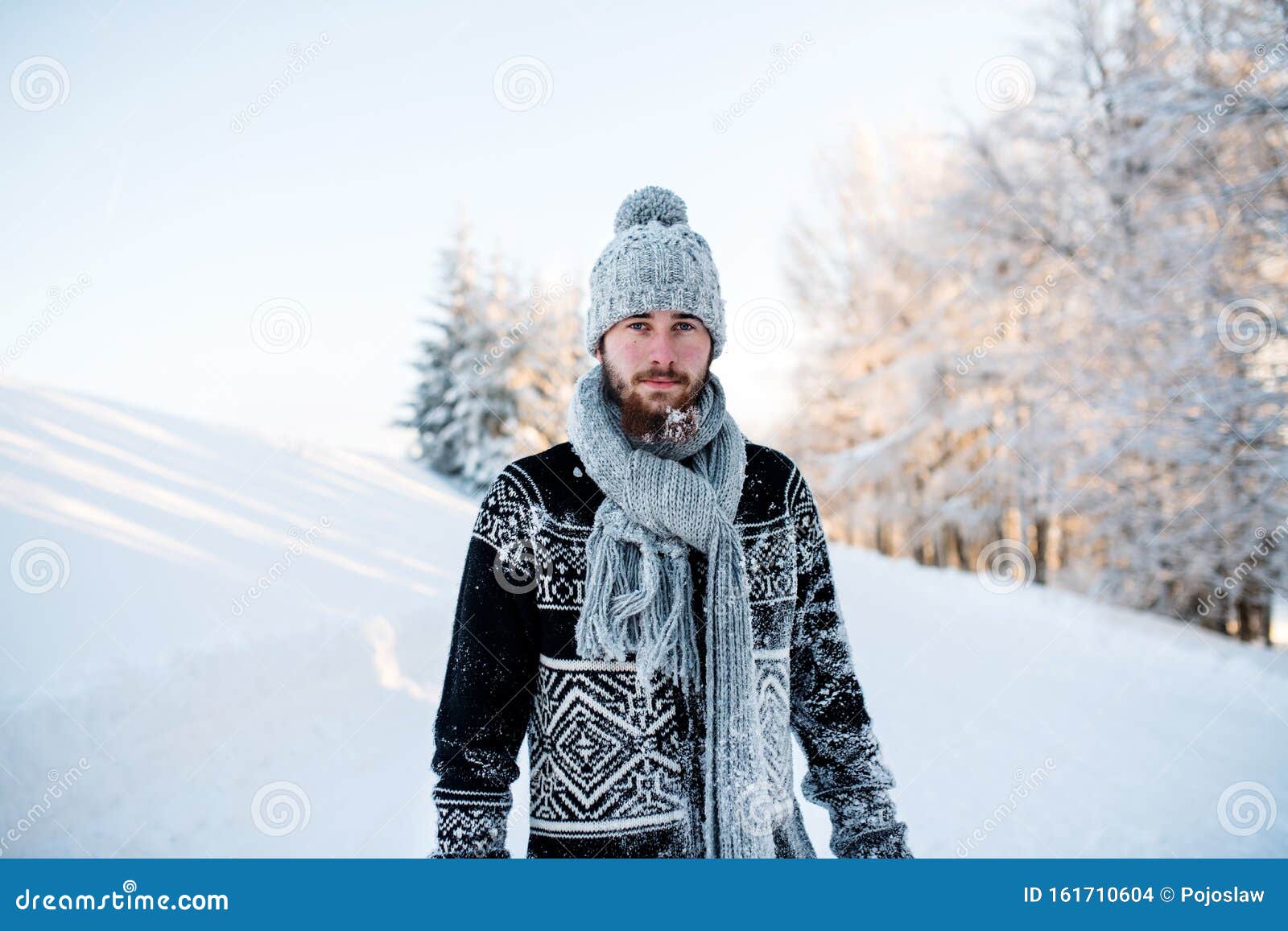 Young Man Standing in Snow Nature Outdoors in Winter, Looking at Camera ...